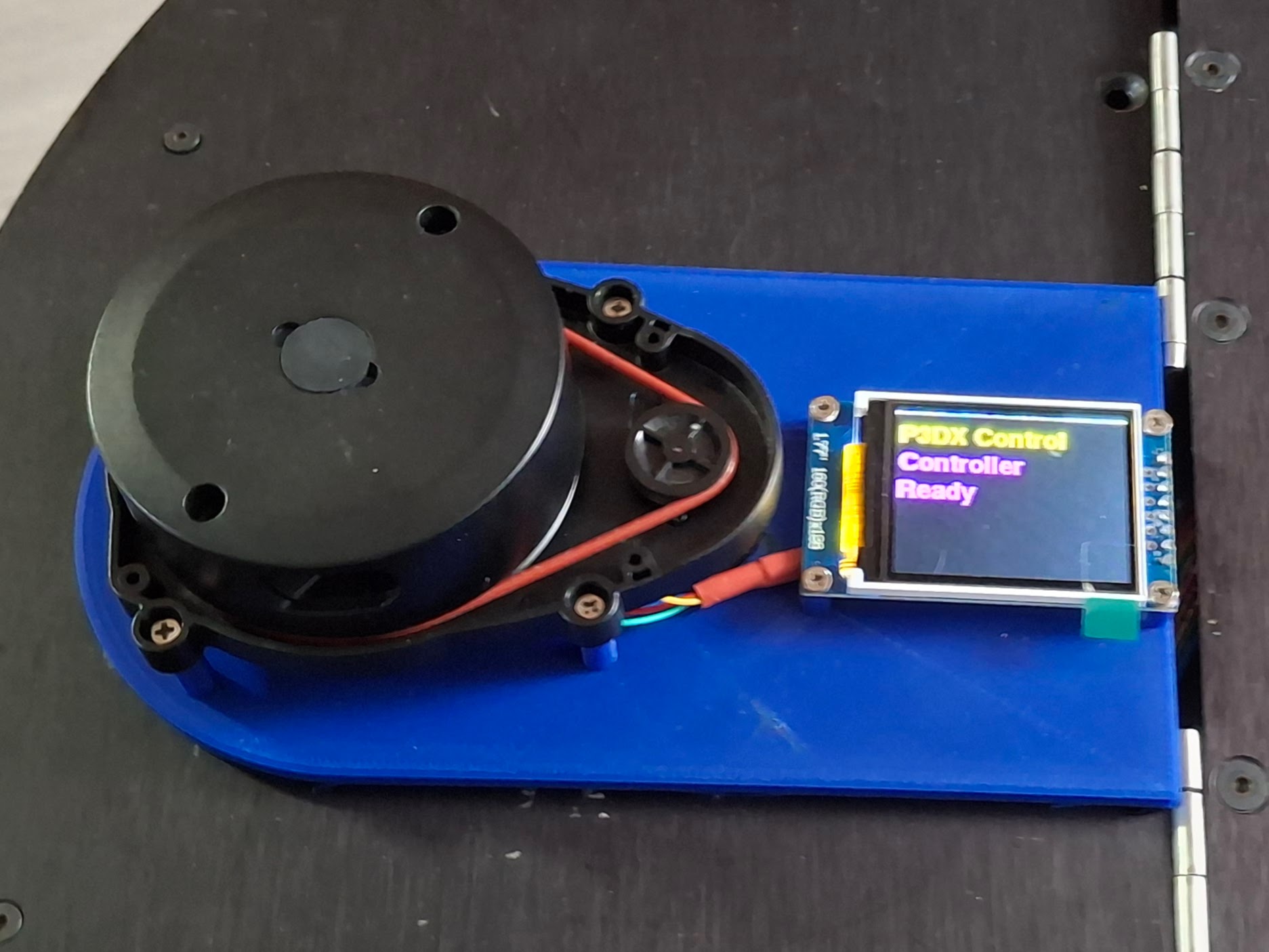 Pioneer 3DX robot showing mounted LIDAR sensor on top and 1.77 inch status display mounted on front panel, both integrated into the modified chassis for autonomous navigation capabilities